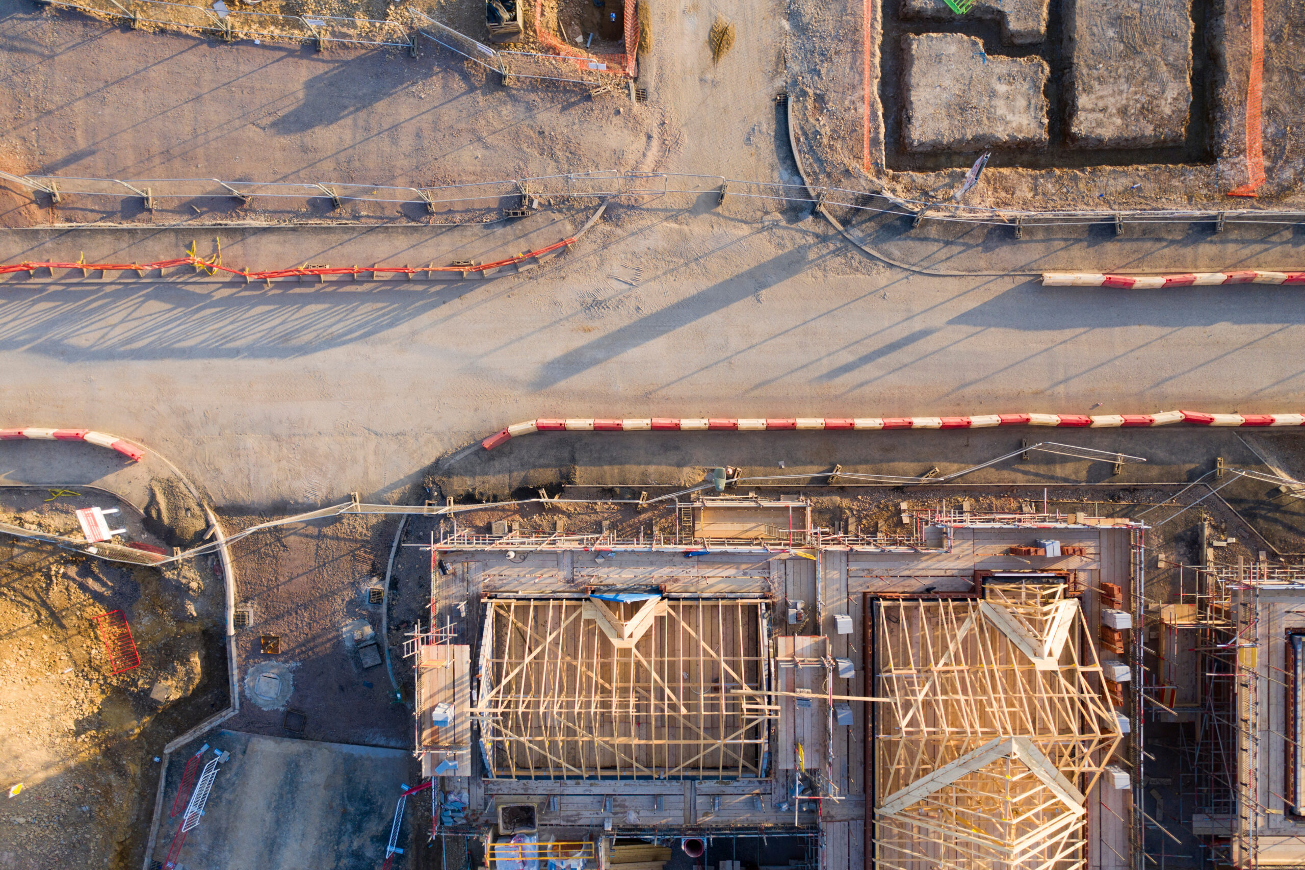 Aerial view over a construction site of new homes being built EV Docking Station